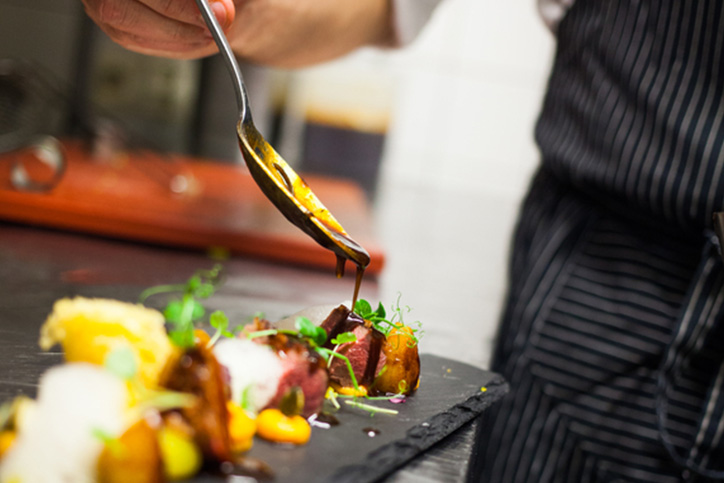 Photograph of chef making food